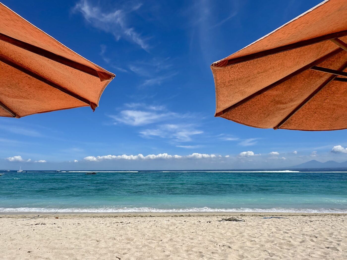 Beach umbrellas over white sand, Nusa Lembongan
